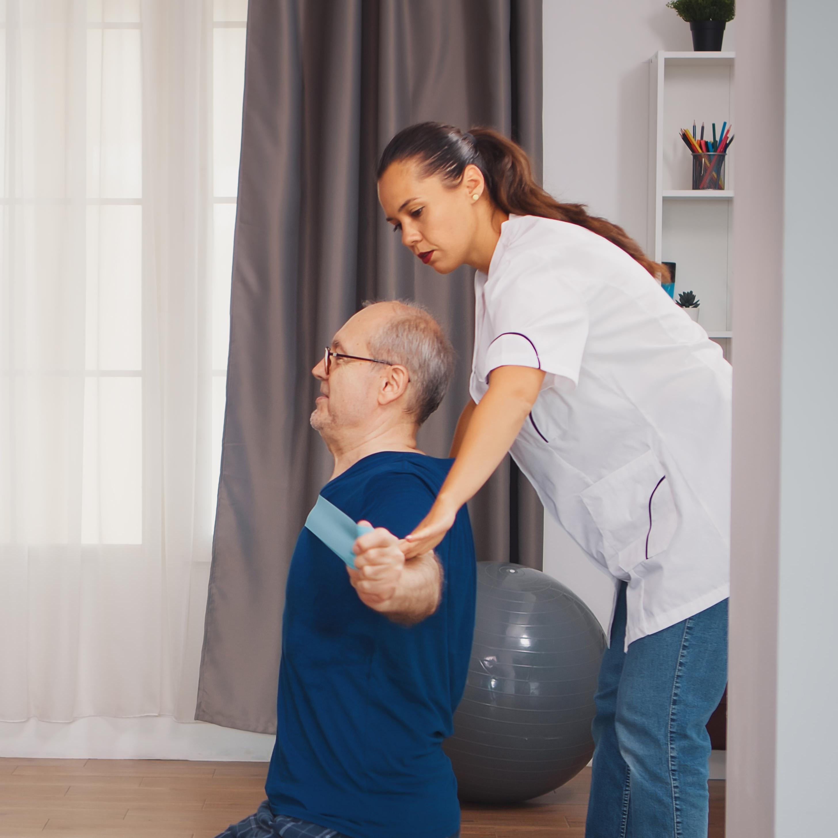 elderly man receiving physical therapy